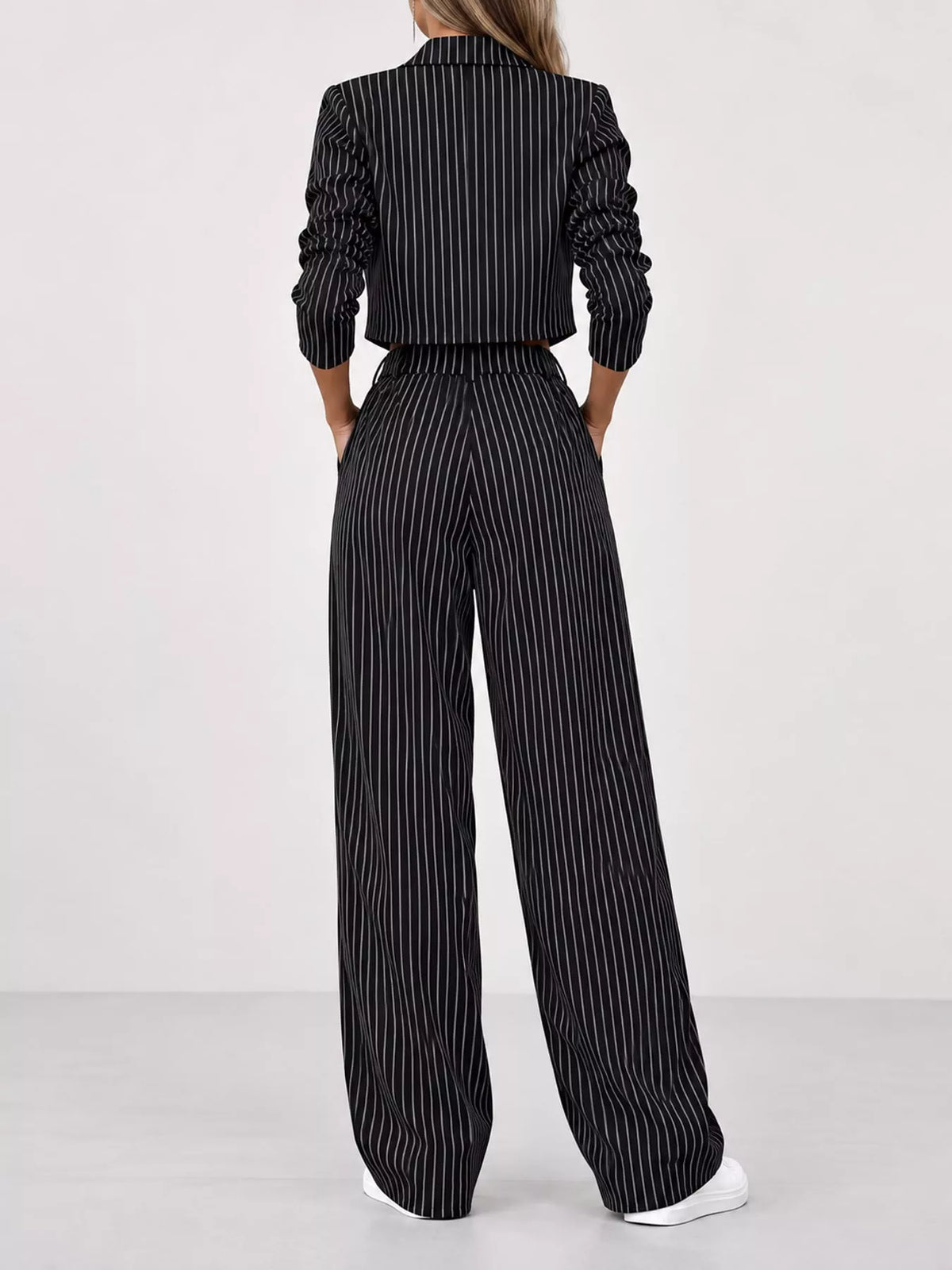 Black pinstripe cropped blazer and wide-leg pants set with matching belt, back view