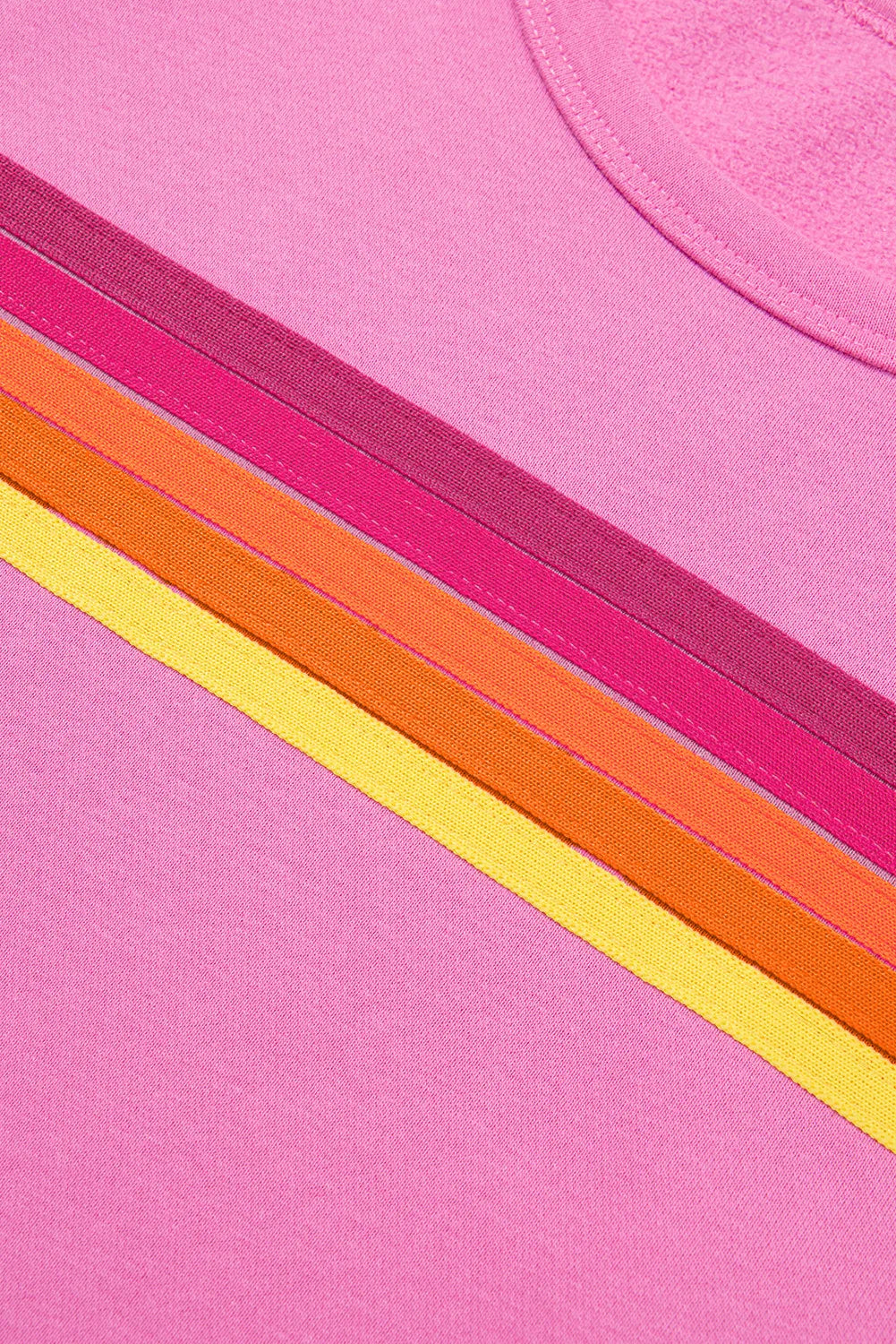Rainbow contrast stripe detail on fuchsia pink knit top front