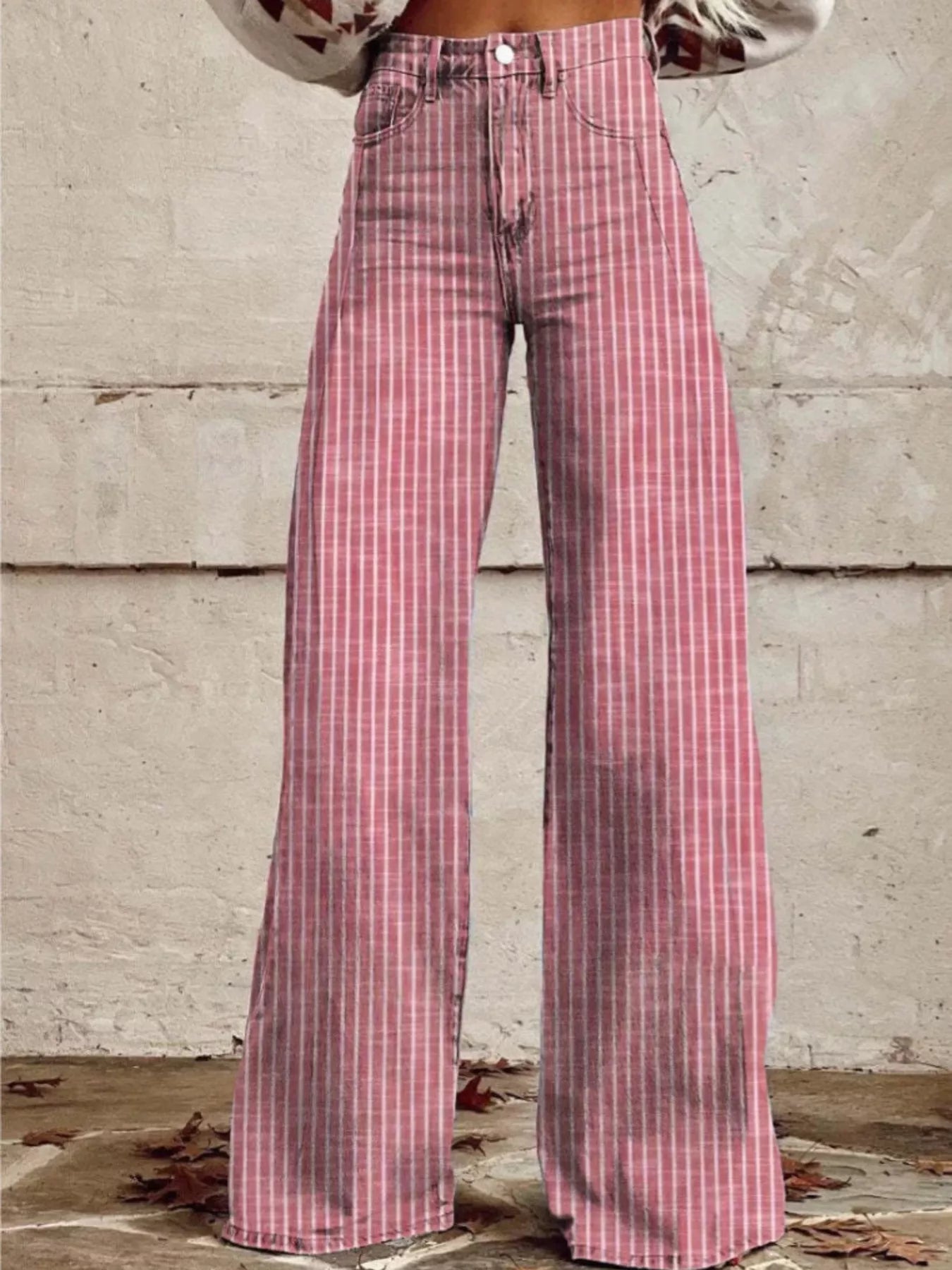 Pink striped high-waisted wide-leg jeans with button fly and belt loops