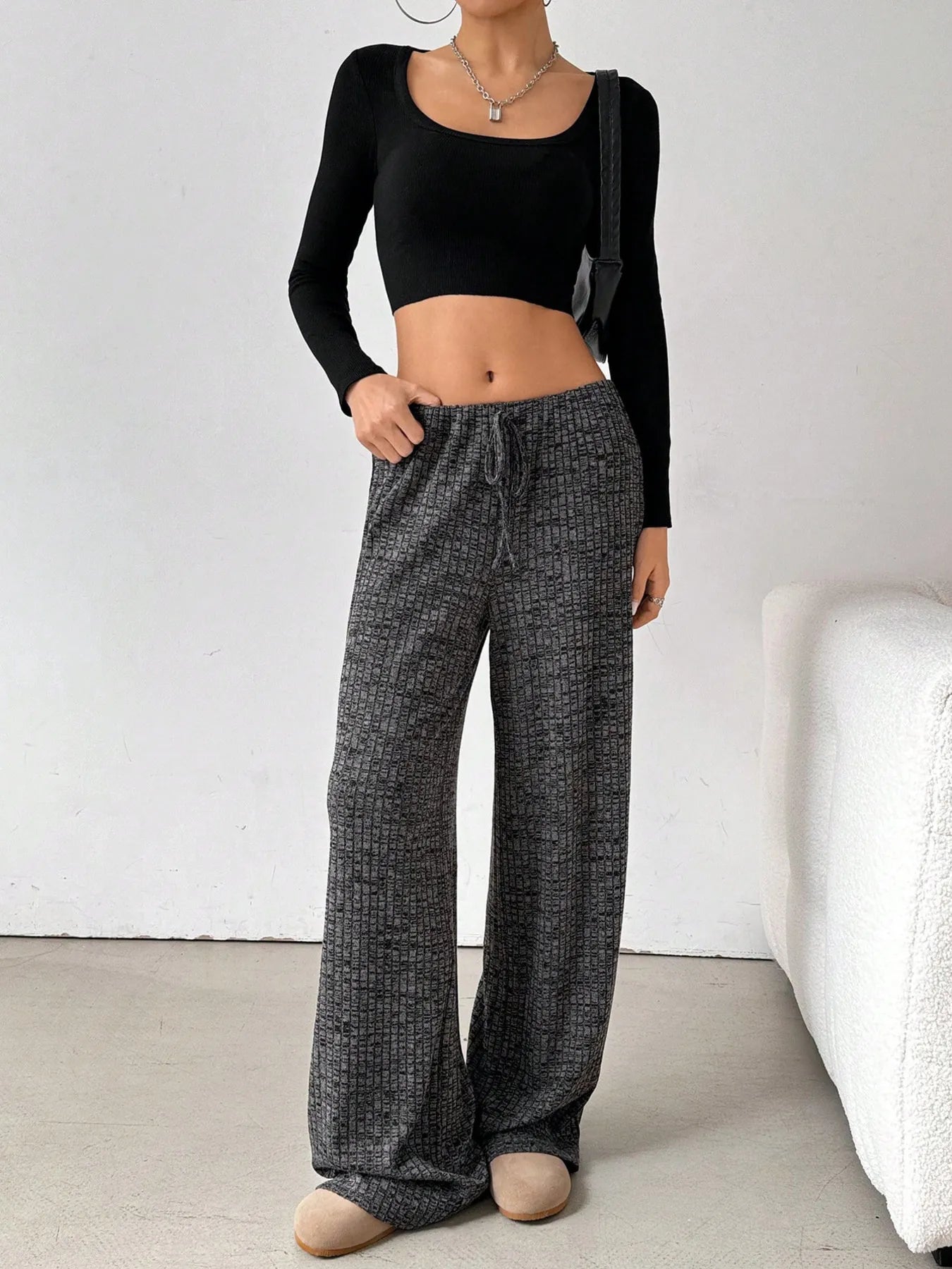 Dark gray striped wide-leg drawstring pants with relaxed fit and wide hems
