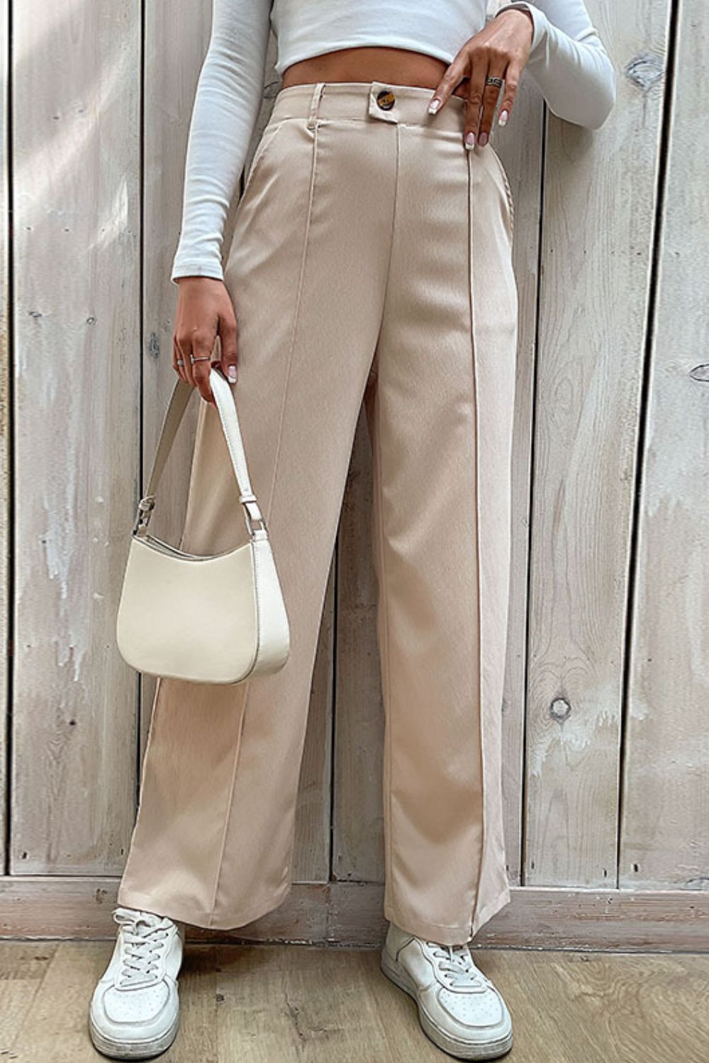 Beige wide-leg center-seam pants, high waist with button closure and front pockets