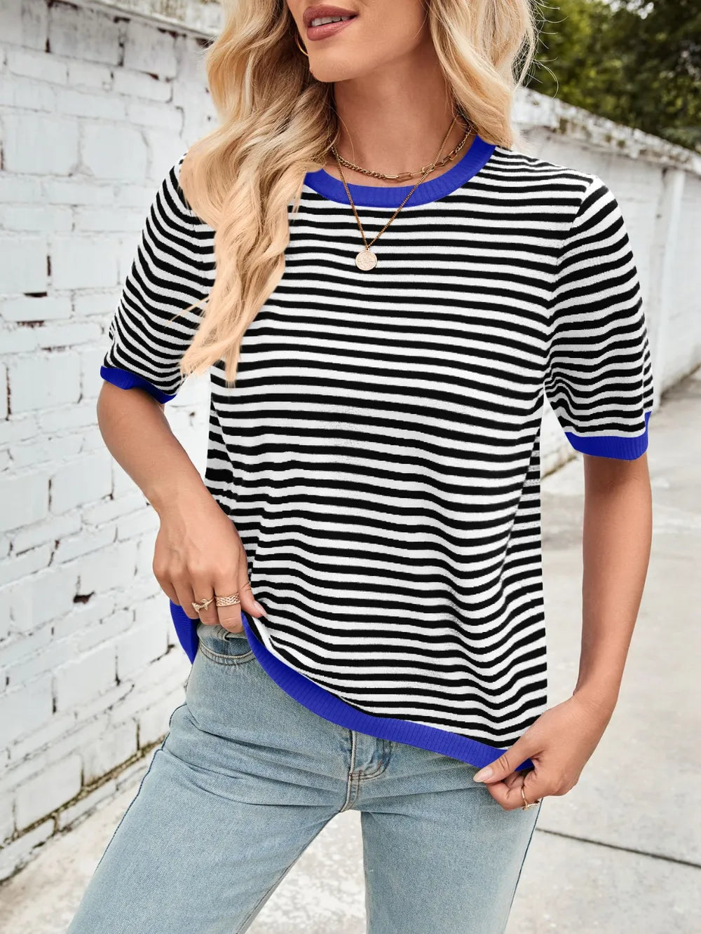 Striped knit top, black-and-white stripes with blue ribbed crew neck and sleeve cuffs