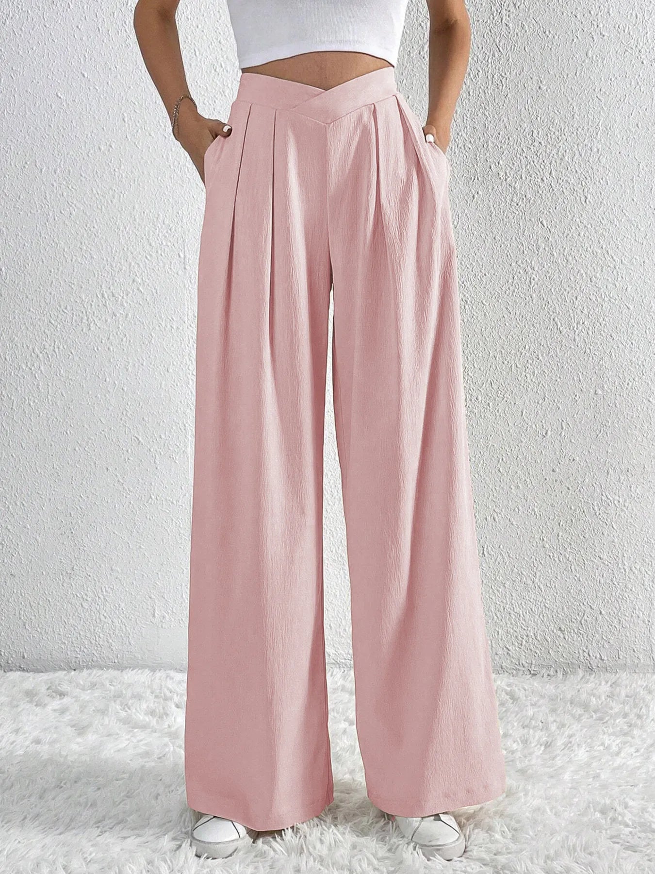 Dusty pink wide-leg pants with ruched front V-shaped waist