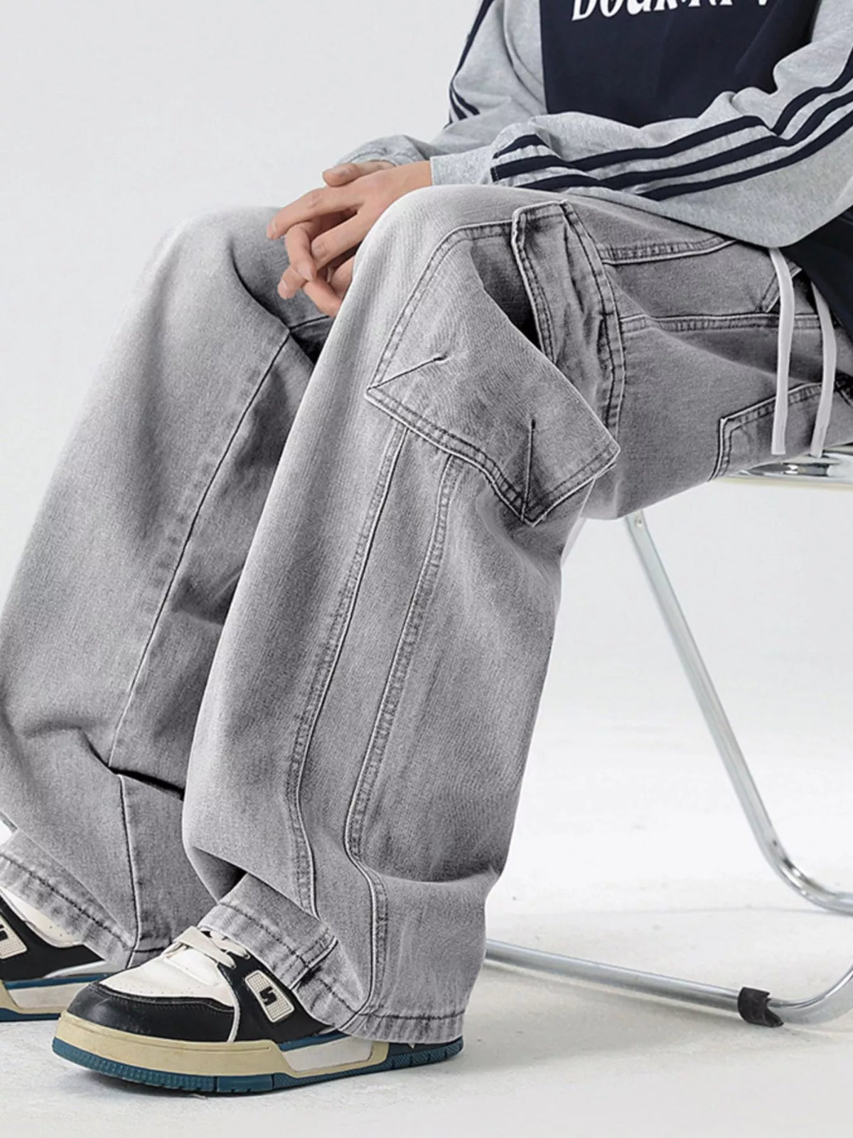 Washed light gray wide-leg cargo jeans with patch pockets and drawcord waist ties