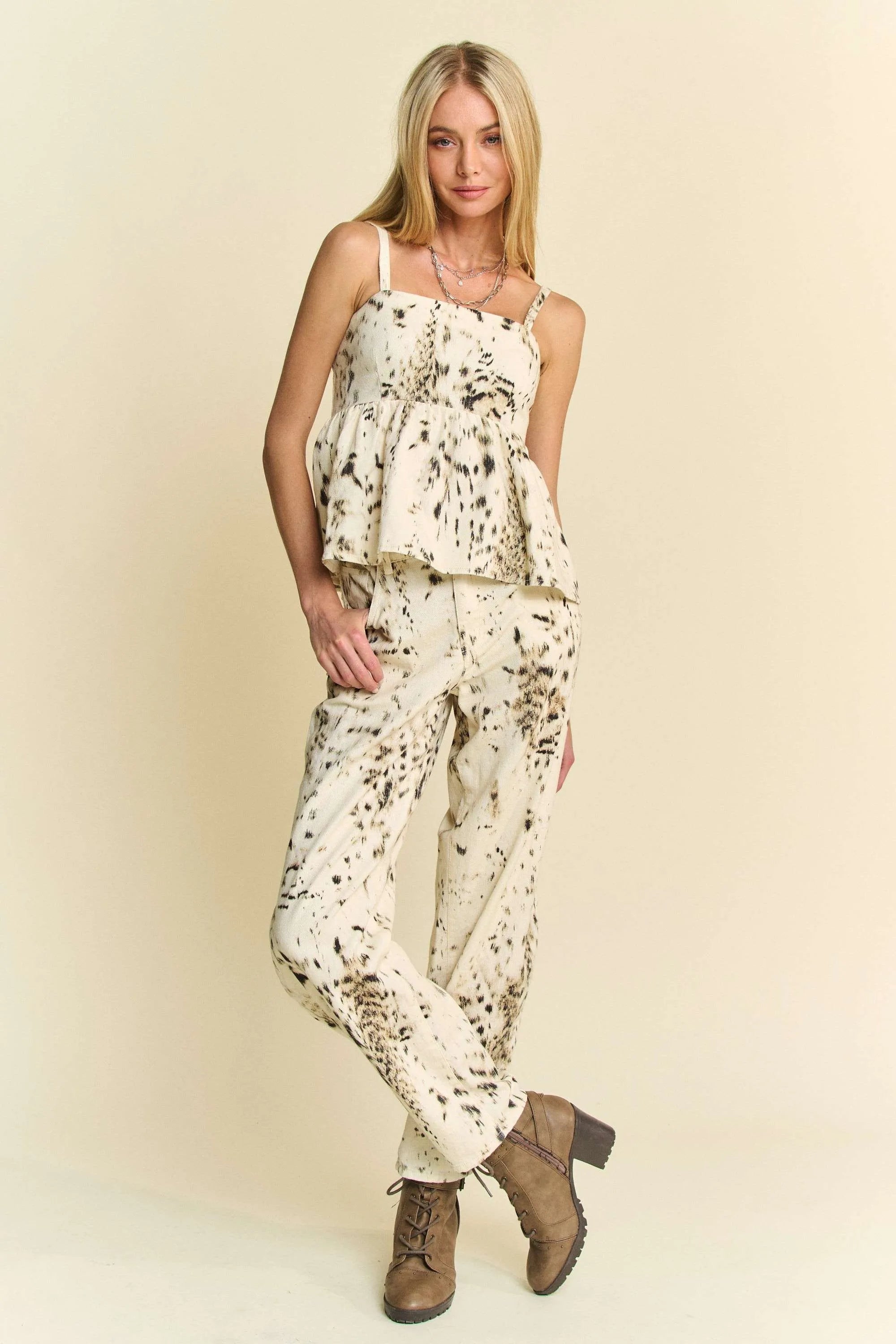 Cream barrel-leg pants with black dot abstract tie-dye print, full-length view