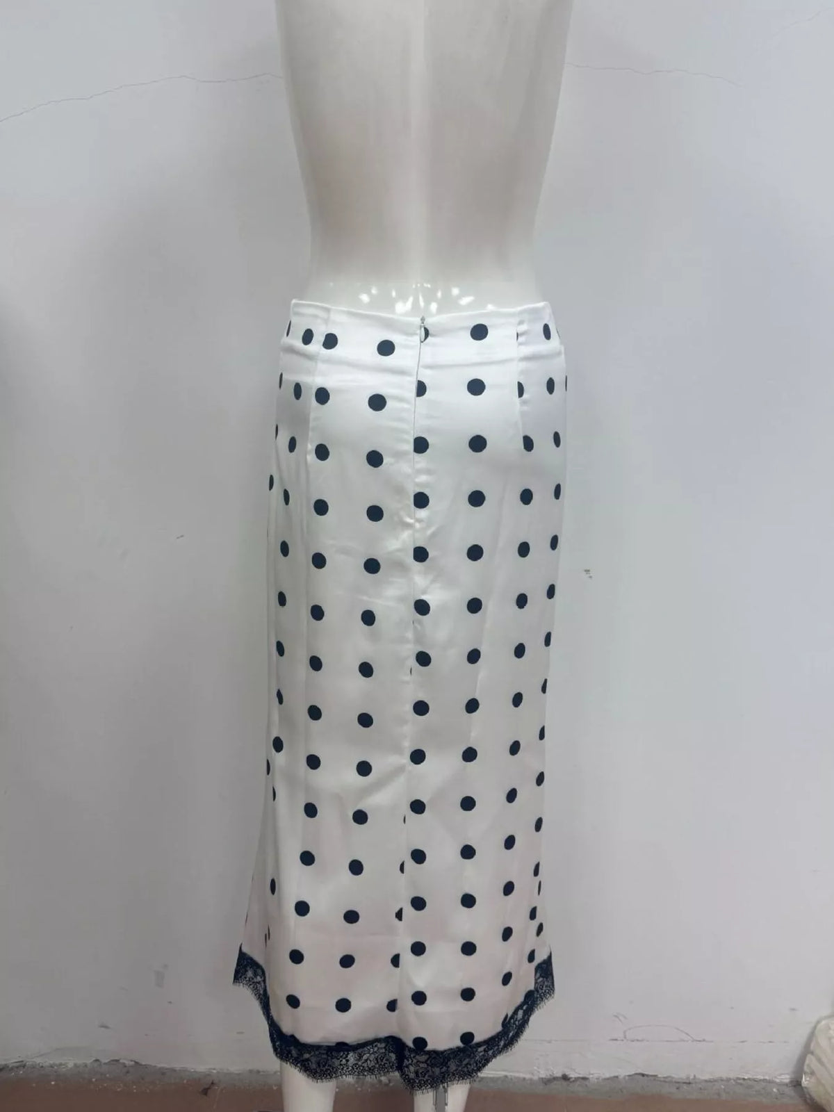 White midi skirt with blue polka dots and lace-trim hem edge