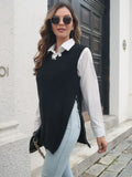 Black knit sweater vest with frayed hem slit, V neckline, over white shirt