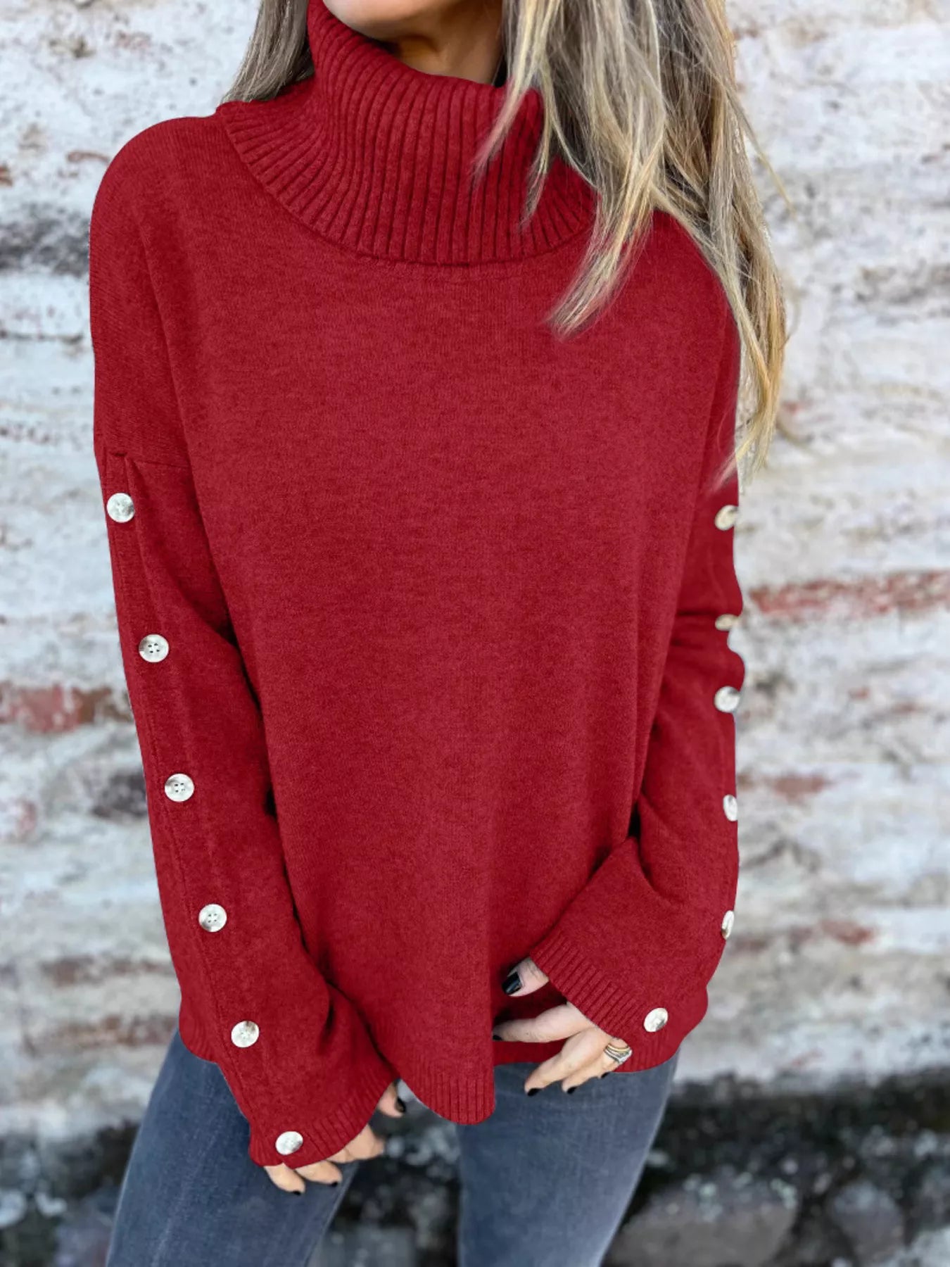Burgundy turtleneck long sleeve sweater with ribbed collar and buttoned sleeve cuffs