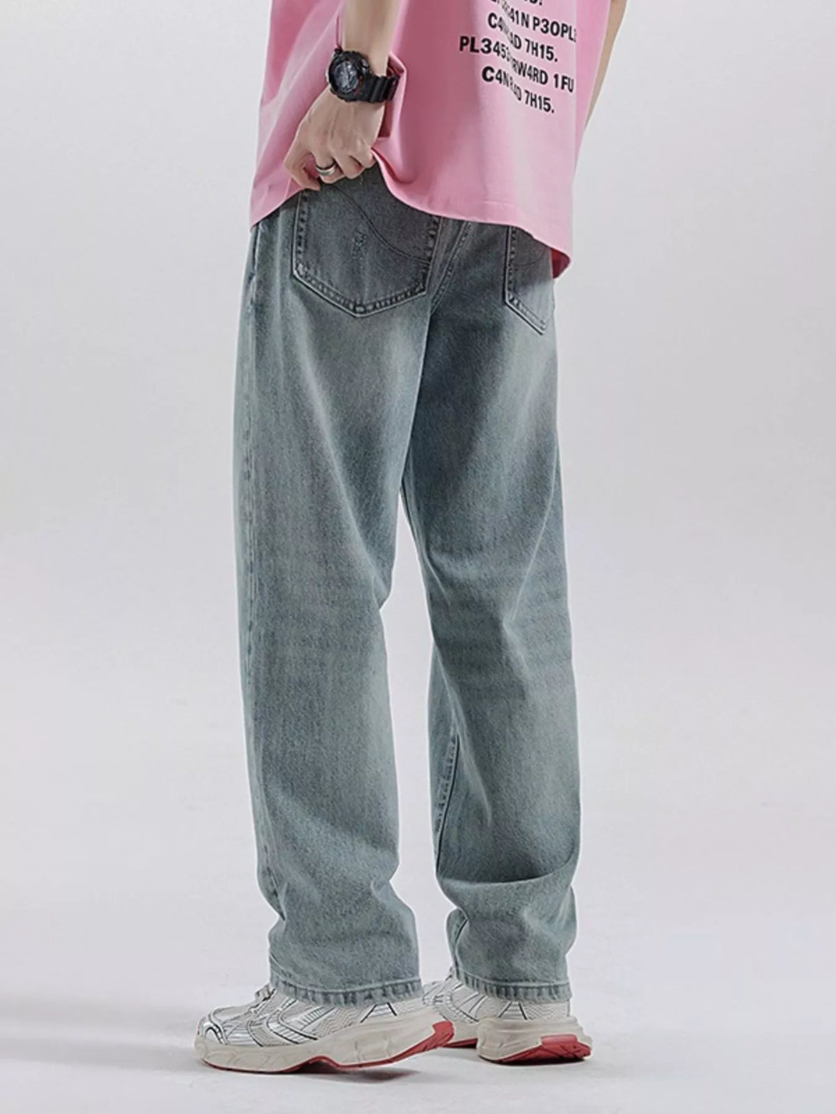 Light blue wide-leg distressed wash cotton jeans with back pockets and knee rip