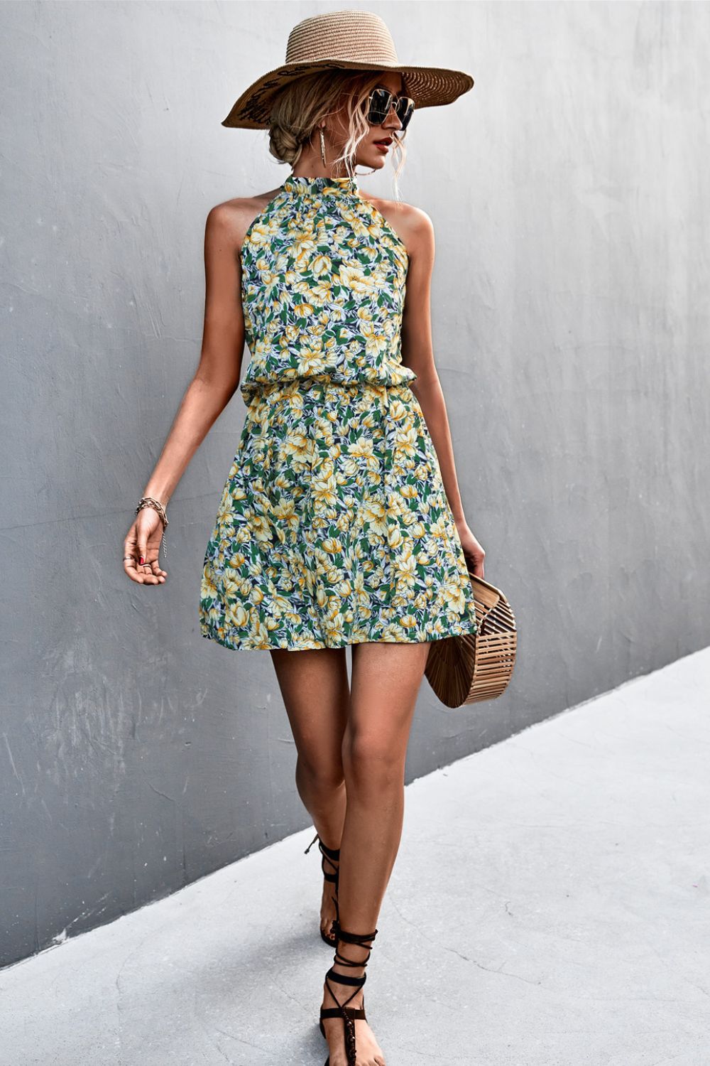 Yellow-green floral mini dress with halter neckline and tiered gathered waist