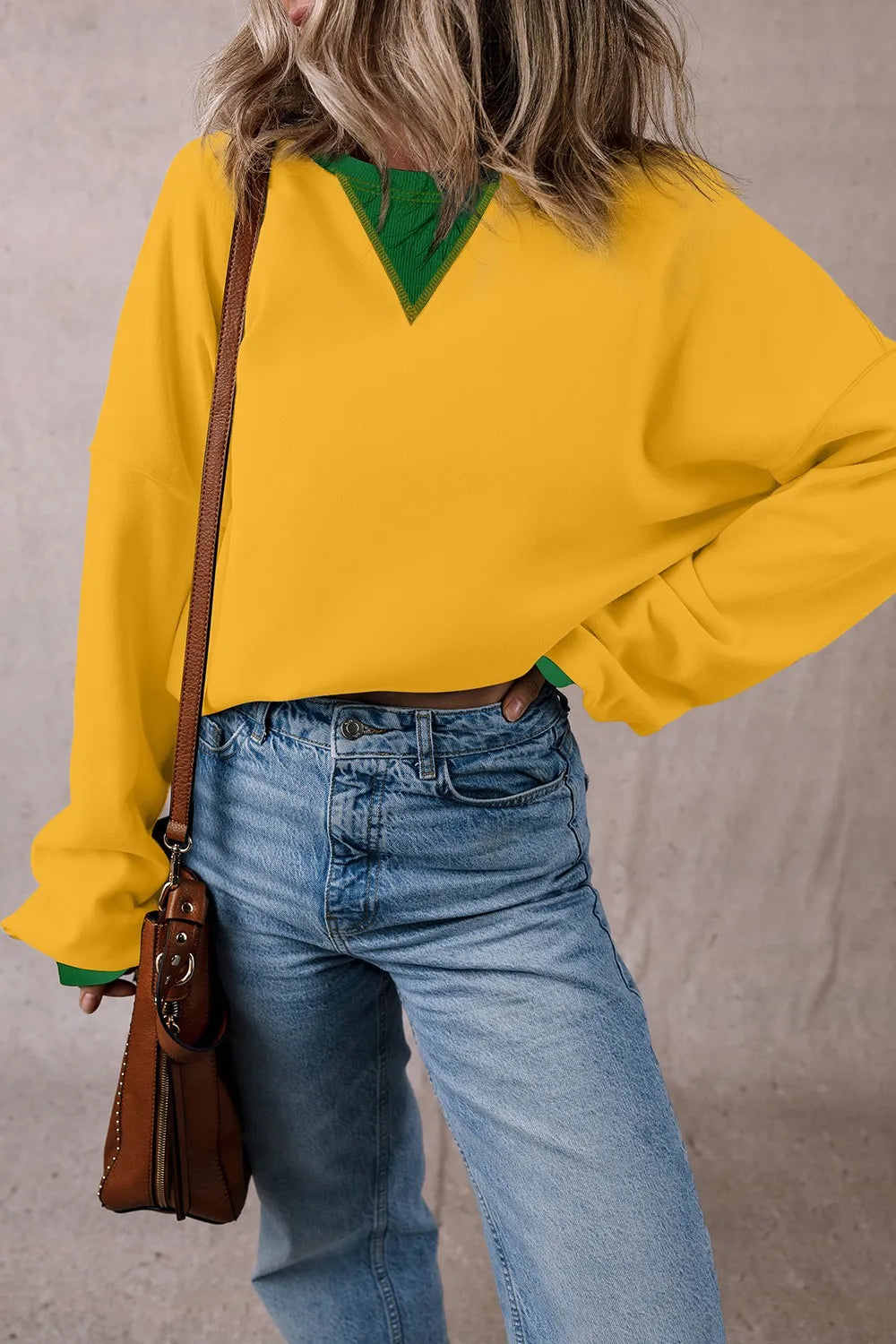 Yellow long-sleeve sweatshirt with green contrast yoke and hem trim