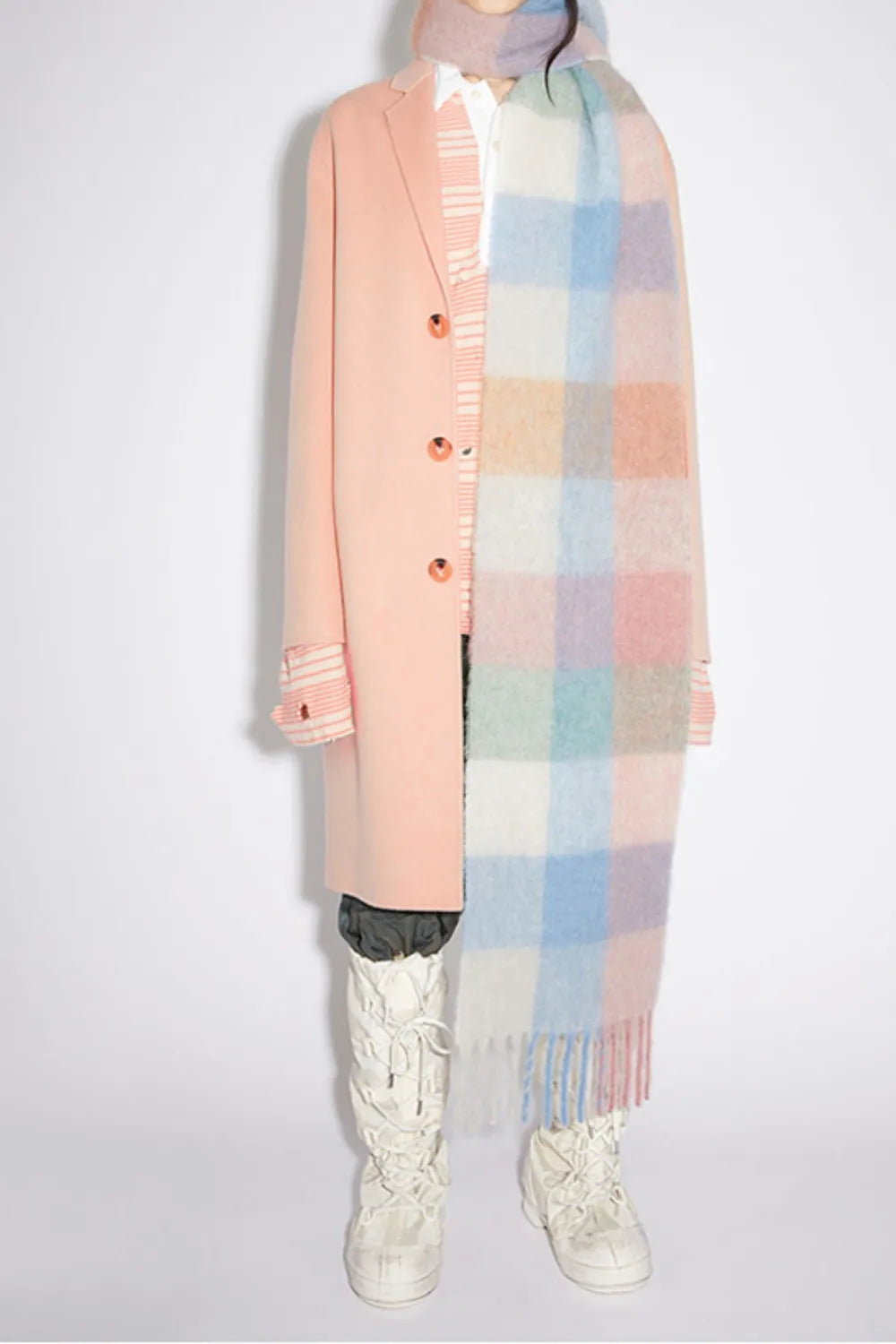 Plaid fringe scarf in pastel pink, peach, and light blue checks