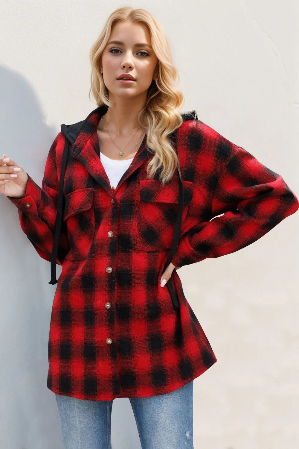Red and black plaid hooded shacket with drawstring hood and long sleeves