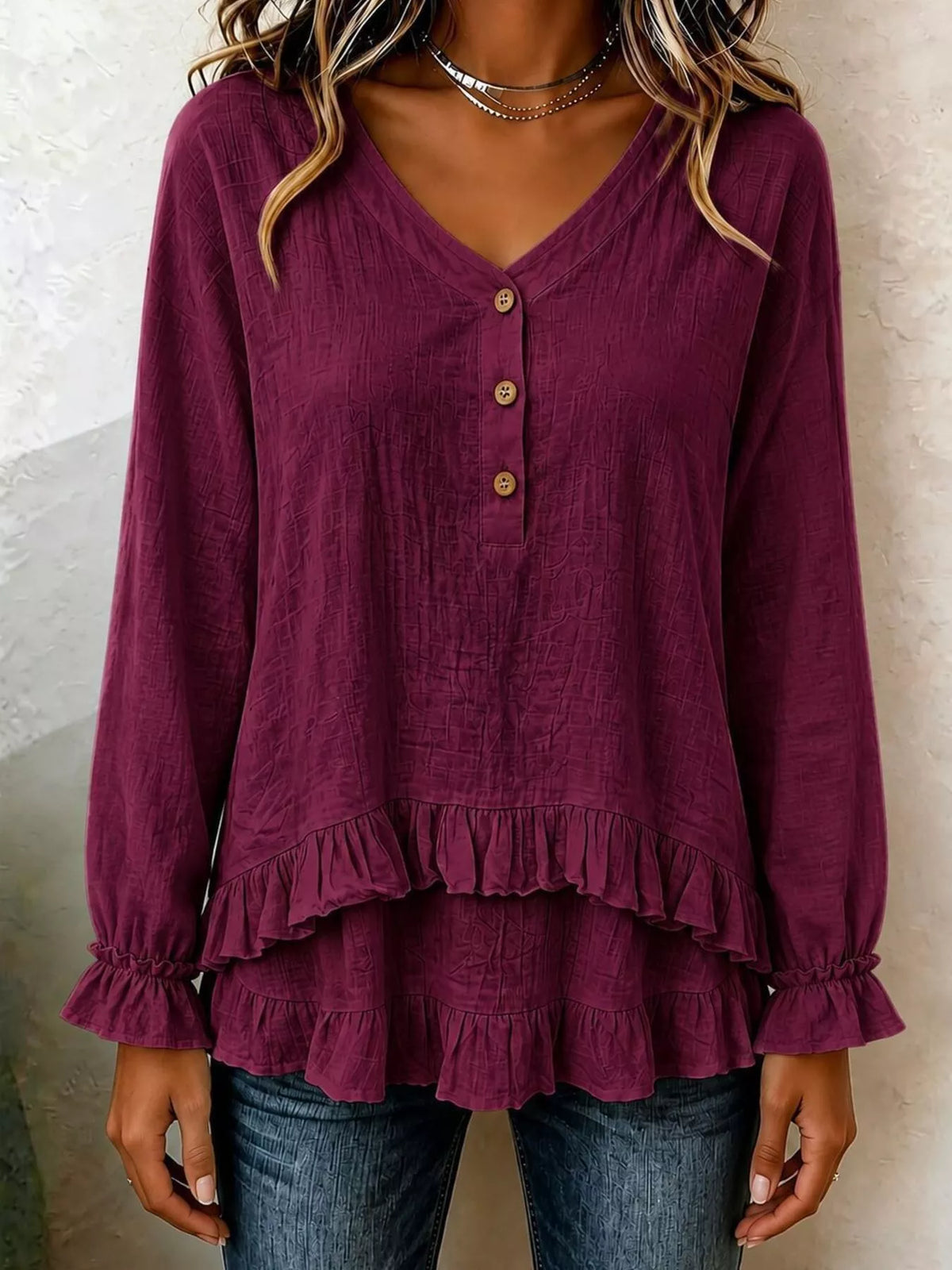 Burgundy v-neck long-sleeve blouse with button front and tiered ruffle hem