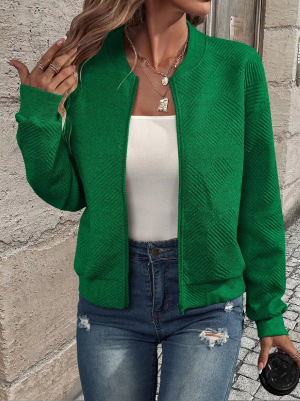 Green textured knit zip-front bomber jacket, long sleeves, ribbed cuffs and hem.