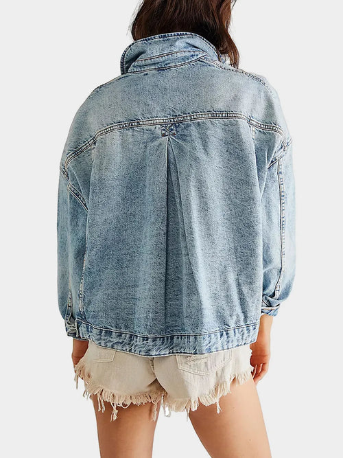 Light wash denim button-up jacket, back view with yoke and stitched seams
