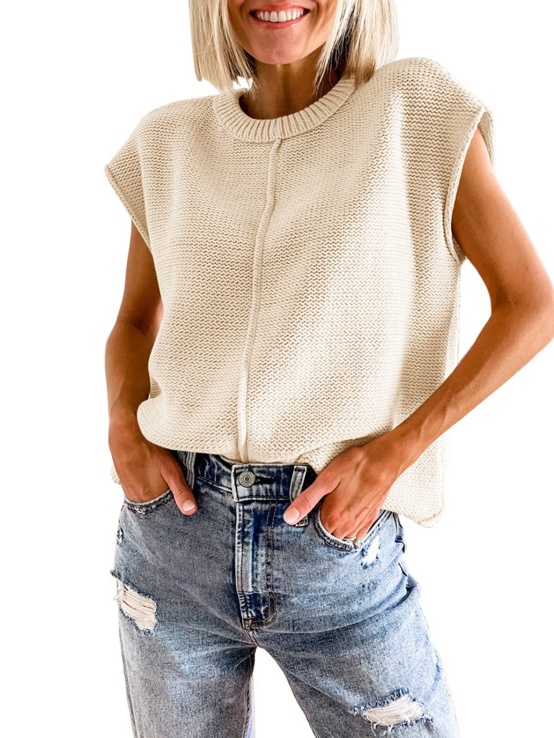 Cap-sleeve sweater vest in light ivory knit with ribbed crew neck and textured stitch pattern