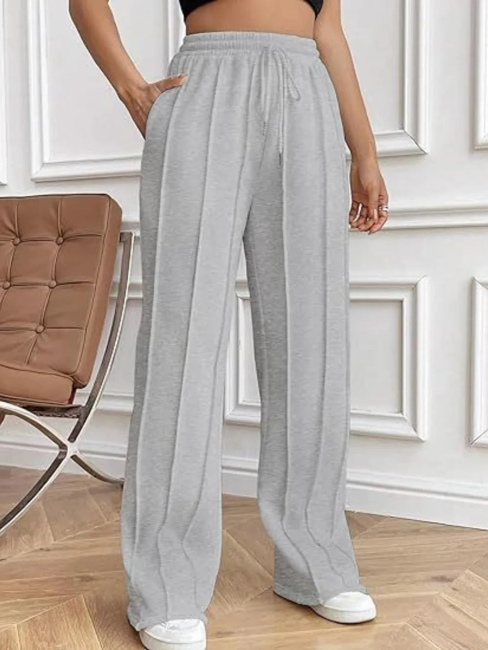 Gray wide-leg drawstring pants with pockets and elastic waistband