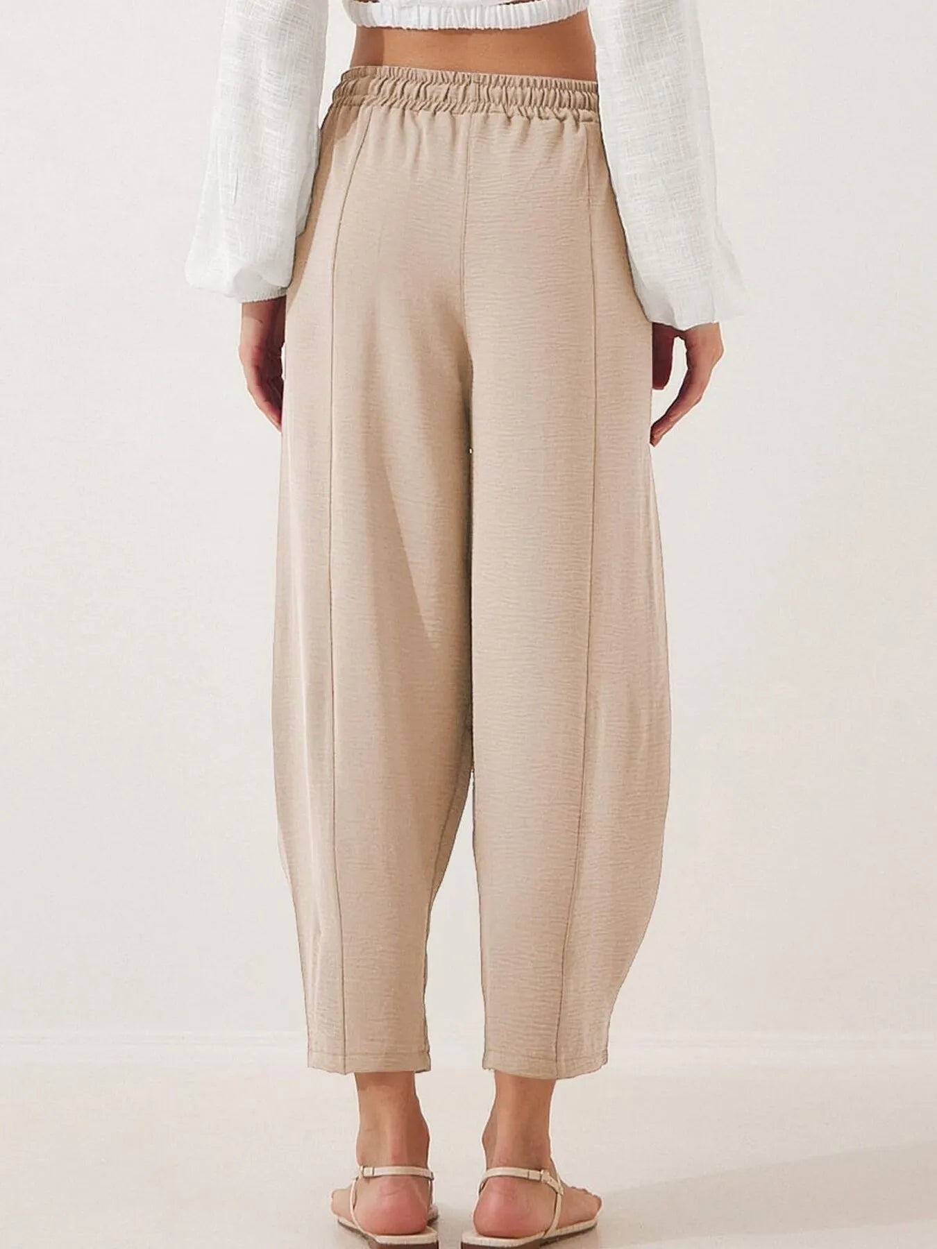 Light beige cropped wide-leg pants with elastic drawstring waist