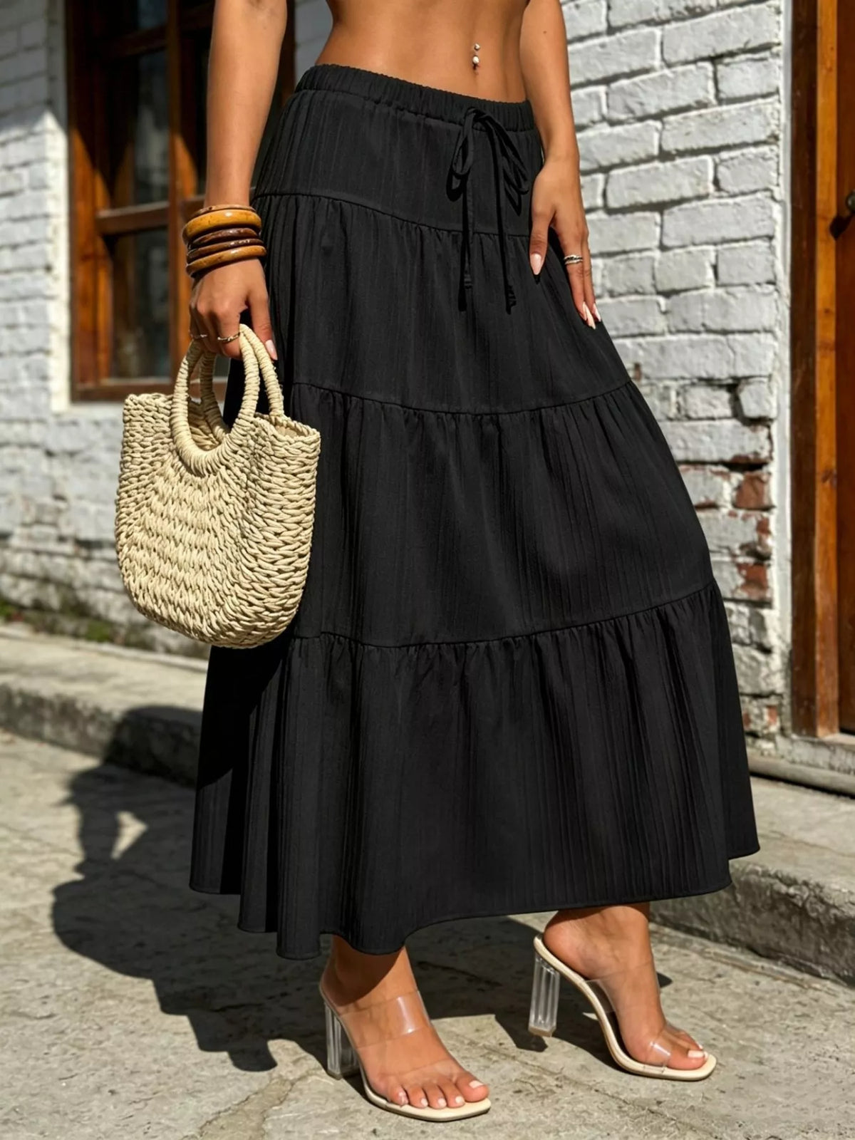 Black tiered maxi skirt with ruched waistband and drawstring tie