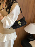 Black suede buckle shoulder bag with flap and gold-tone clasp