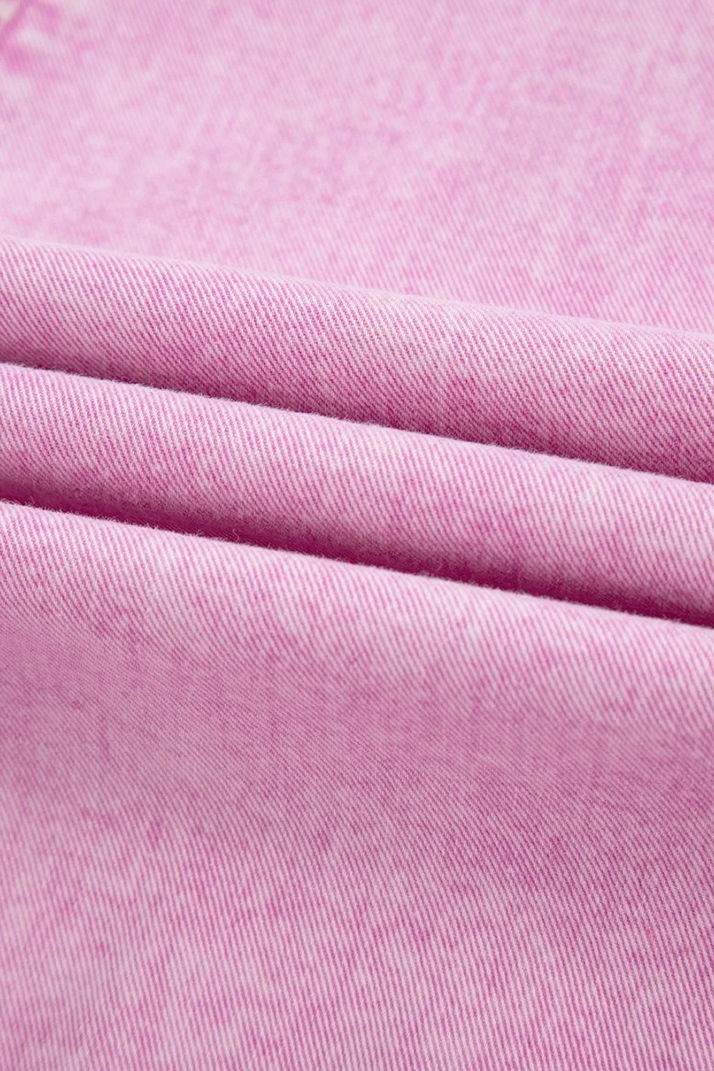 Pink mineral wash denim romper fabric with pleated texture