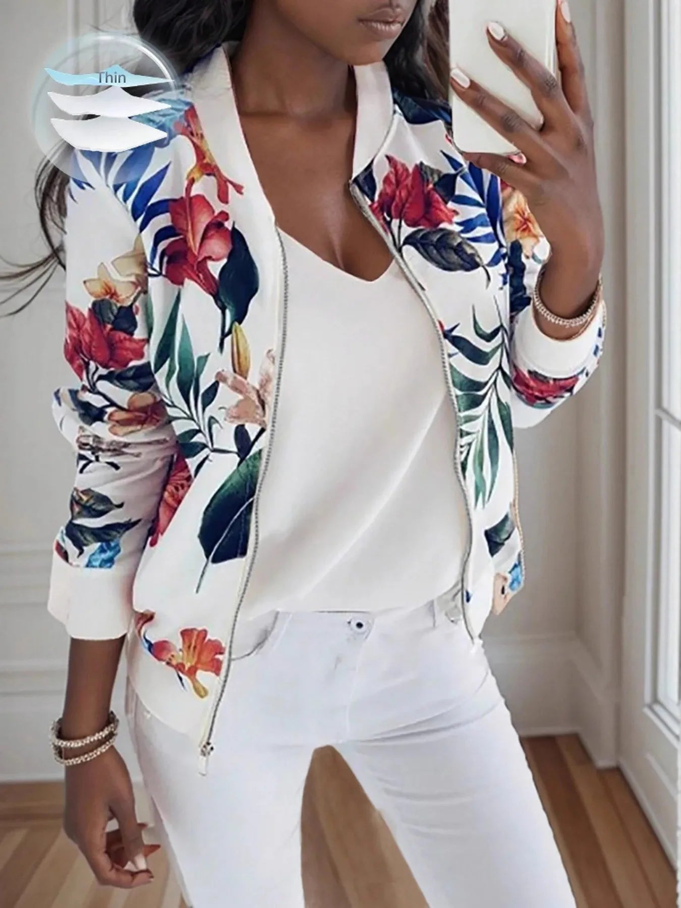 Floral zip-up long-sleeve jacket with white front and multicolor tropical leaf print