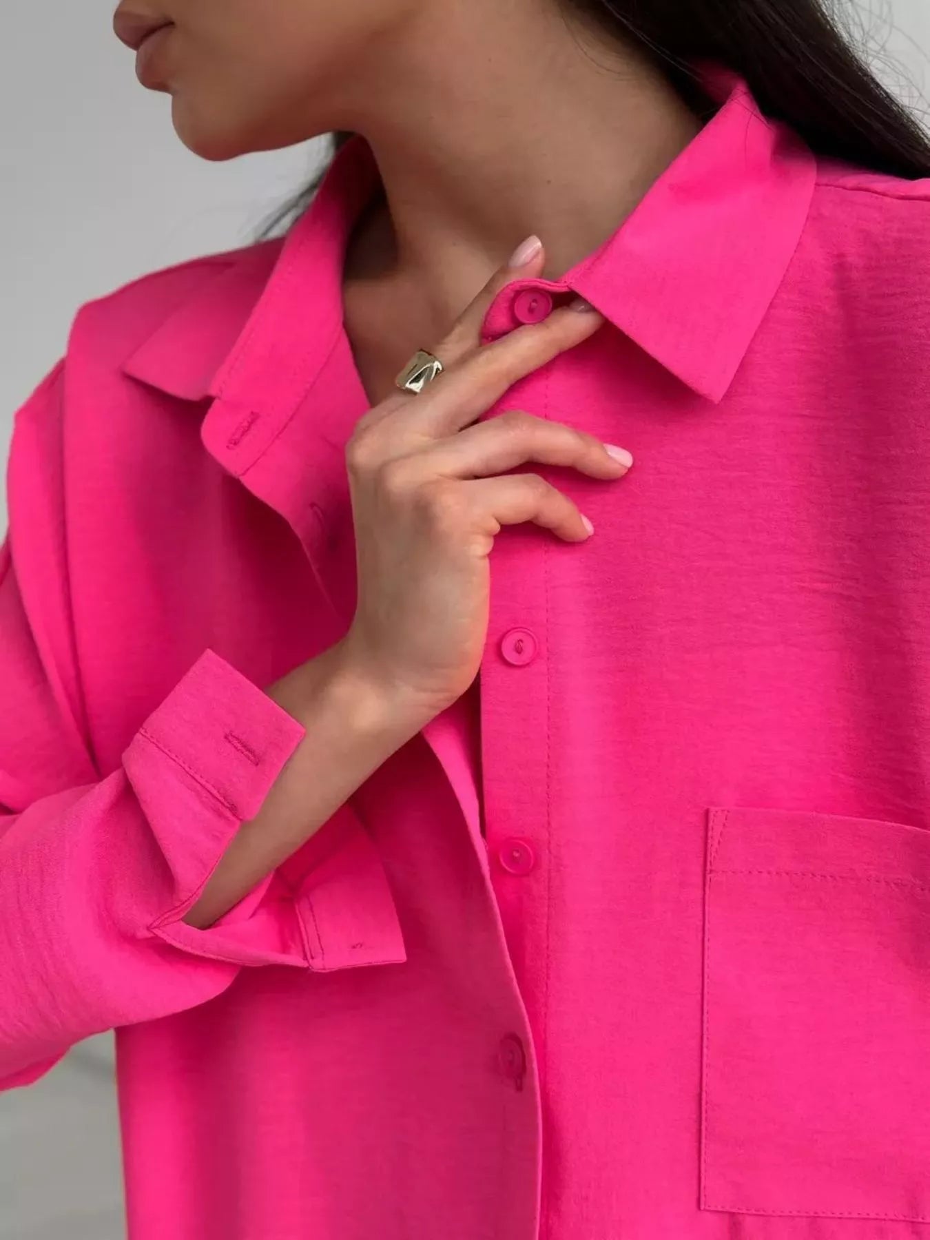 Hot pink relaxed-fit shirt and wide-leg pants set, close-up of button collar and pocket