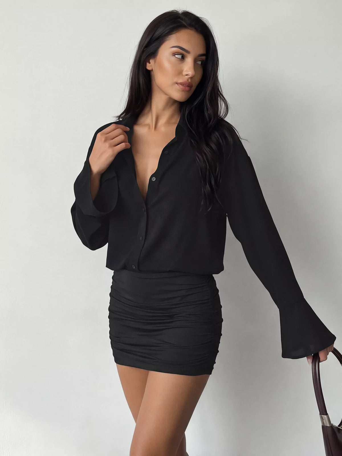 Black button-front shirt dress with ruched mini skirt and flared bell sleeves