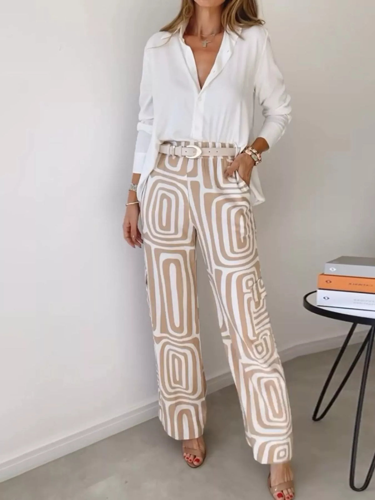 Button-down shirt and geometric patterned pants set in cream and tan.