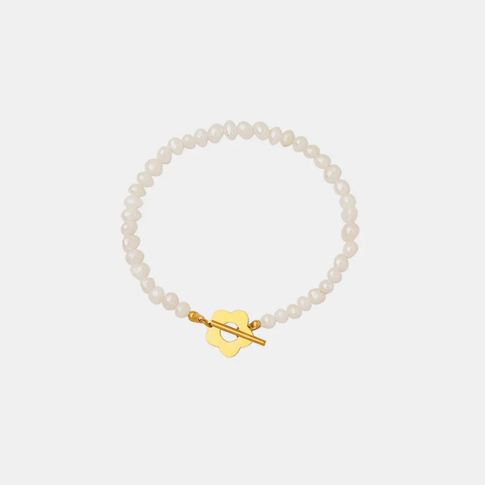 Pearl bead bracelet with gold flower toggle clasp