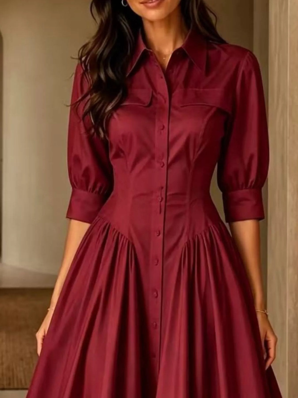 Burgundy button-down shirt dress with cinched waist, 3/4 puff sleeves, and button front.