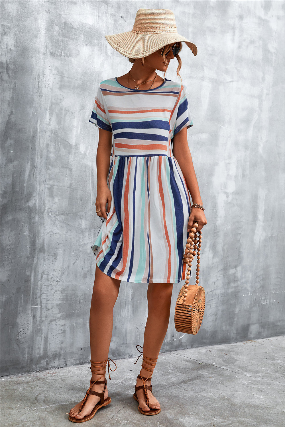 Striped round-neck dress with short sleeves and gathered waist, vertical multi-color stripes