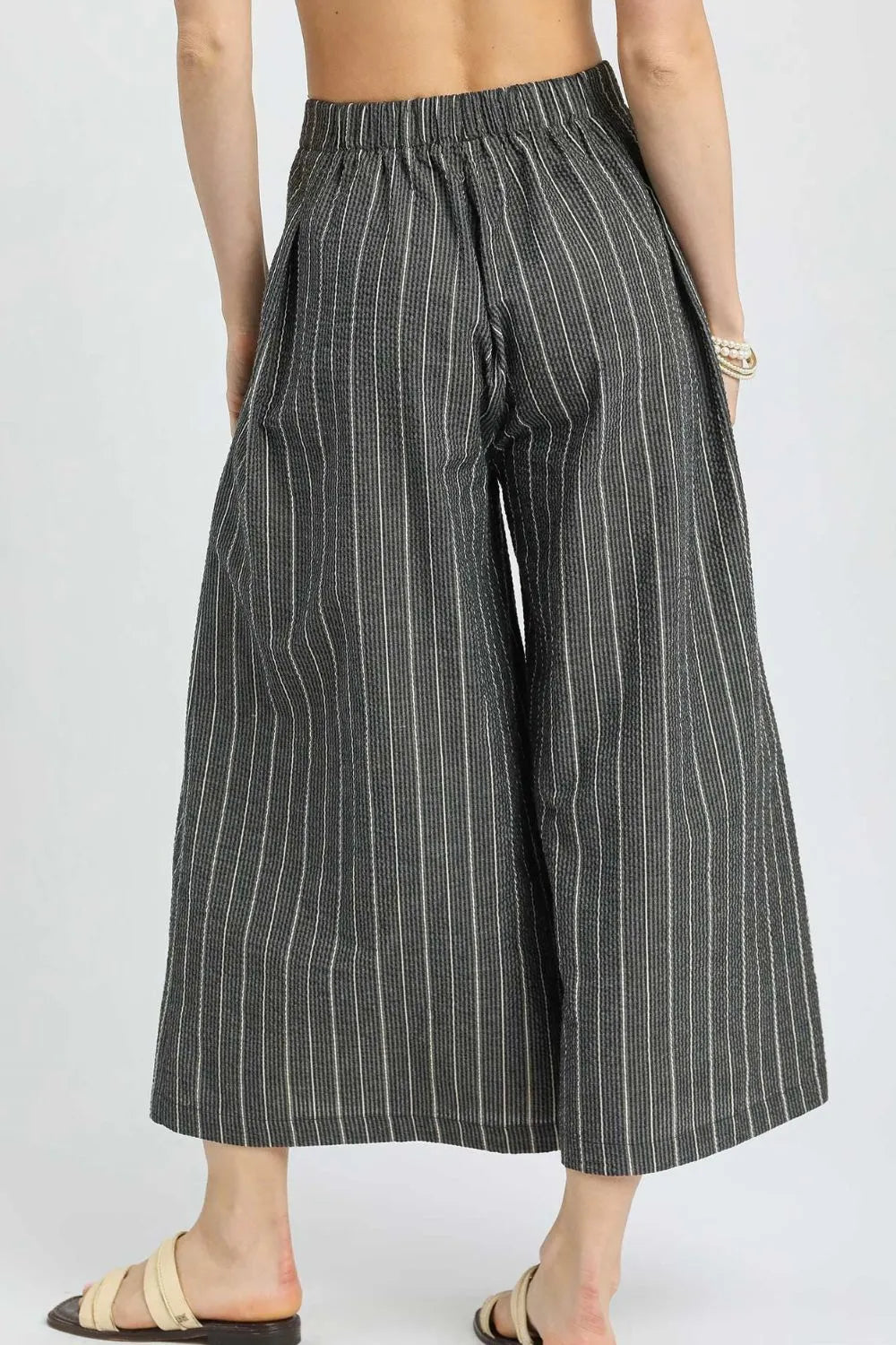 Pinstripe crop palazzo pants with elastic waist and vertical stripes, wide cropped legs