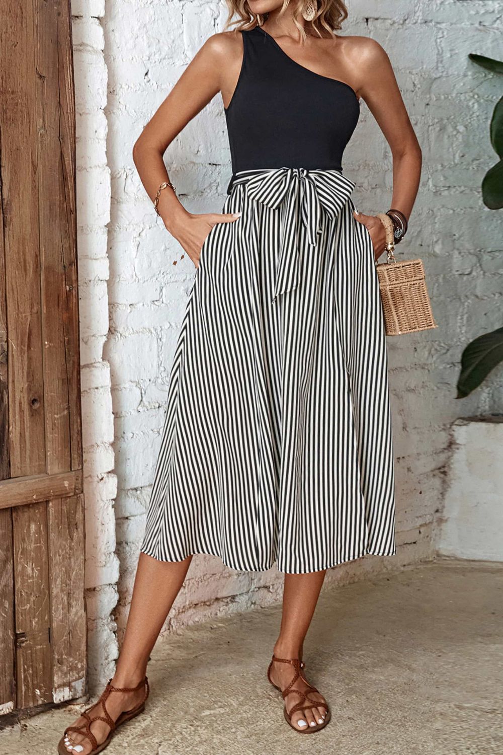 One-shoulder black bodice striped midi dress with bow-tie waist and front slit