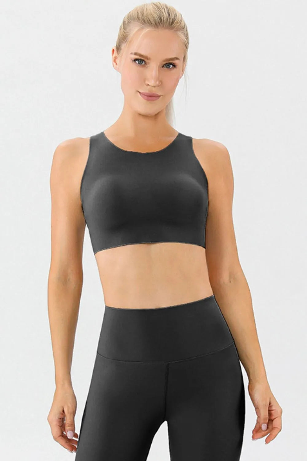 Black active sports bra with round neckline and wide straps, front view
