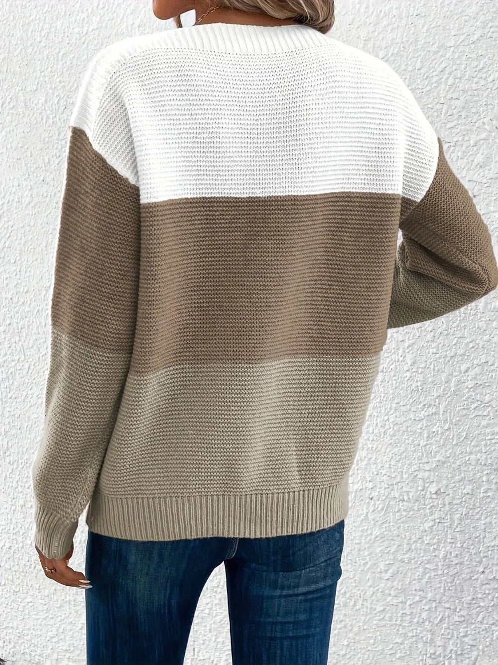 Back view of color block knit sweater in white and taupe, boat neck, long sleeves.