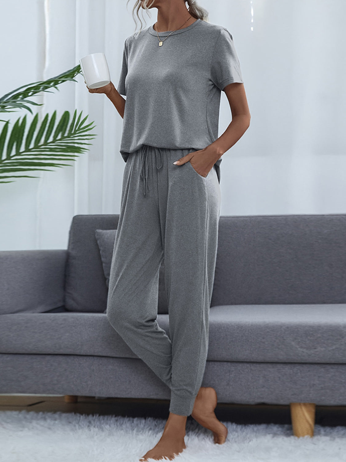 Light gray round-neck short-sleeve top and jogger pants set, draped fit, drawstring waist