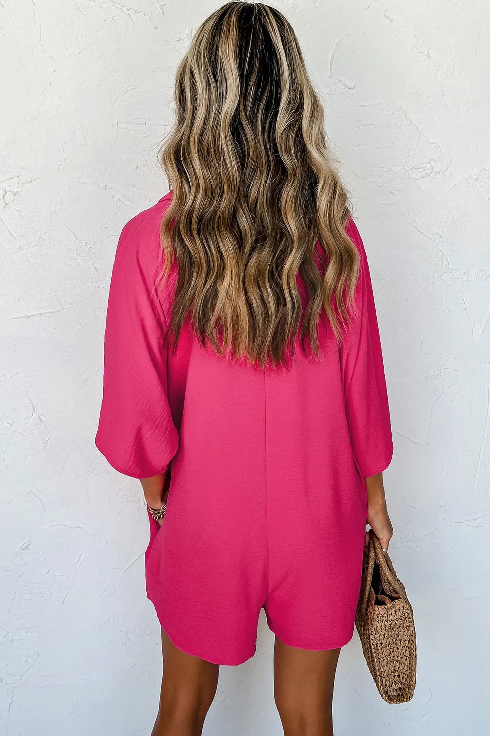 Hot pink half-button collared neck romper, back view, short sleeves