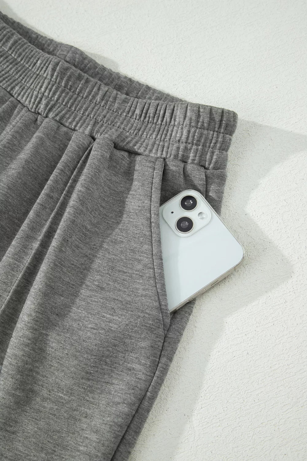 Dark gray casual pants with elastic waistband and drawstring, side pocket