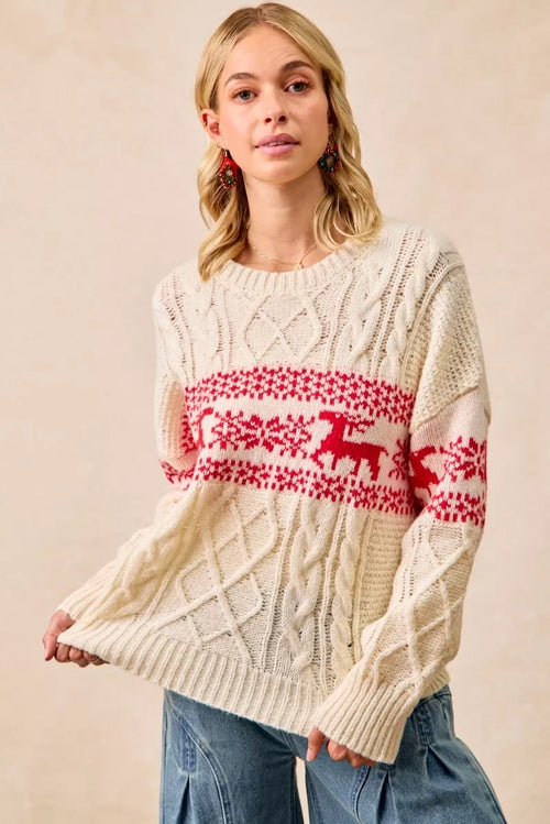 Cream cable knit sweater with red fair isle band and reindeer motif, long sleeves