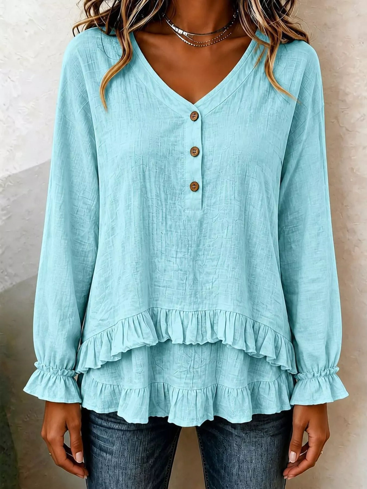 Sky blue V-neck long-sleeve blouse with button placket and ruffled hem