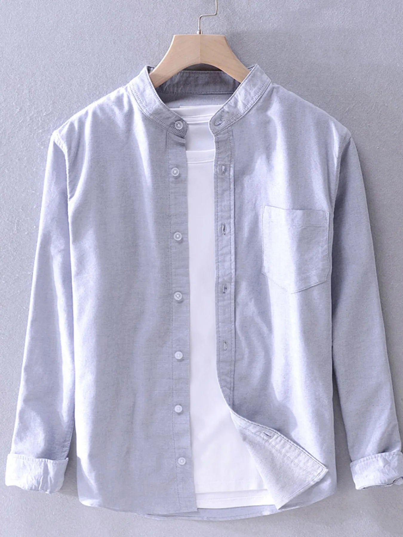 Long-sleeve button-up shirt in light grey with button placket and chest pocket