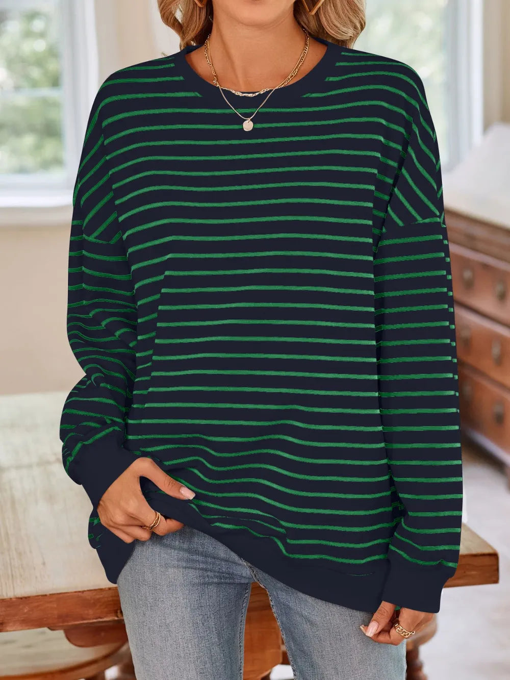 Striped round-neck long-sleeve sweatshirt, dark green with green horizontal stripes and relaxed fit