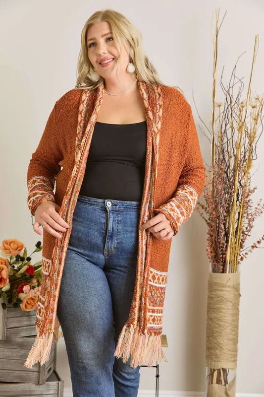 Rust aztec border cardigan with fringe hem and patterned sleeve cuffs, open front