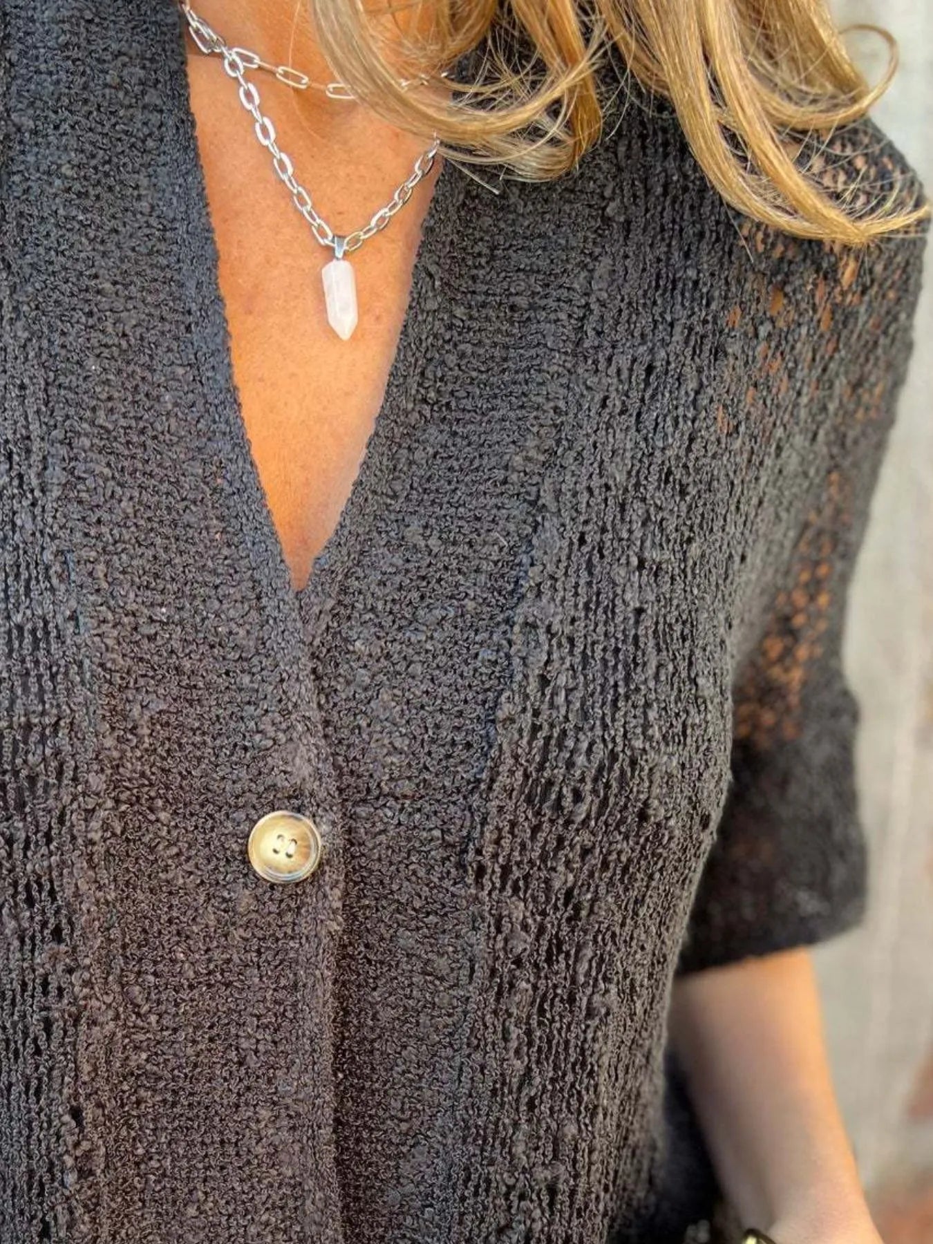 Dark brown open-knit one-button half-sleeve cardigan with deep V-neck and button detail