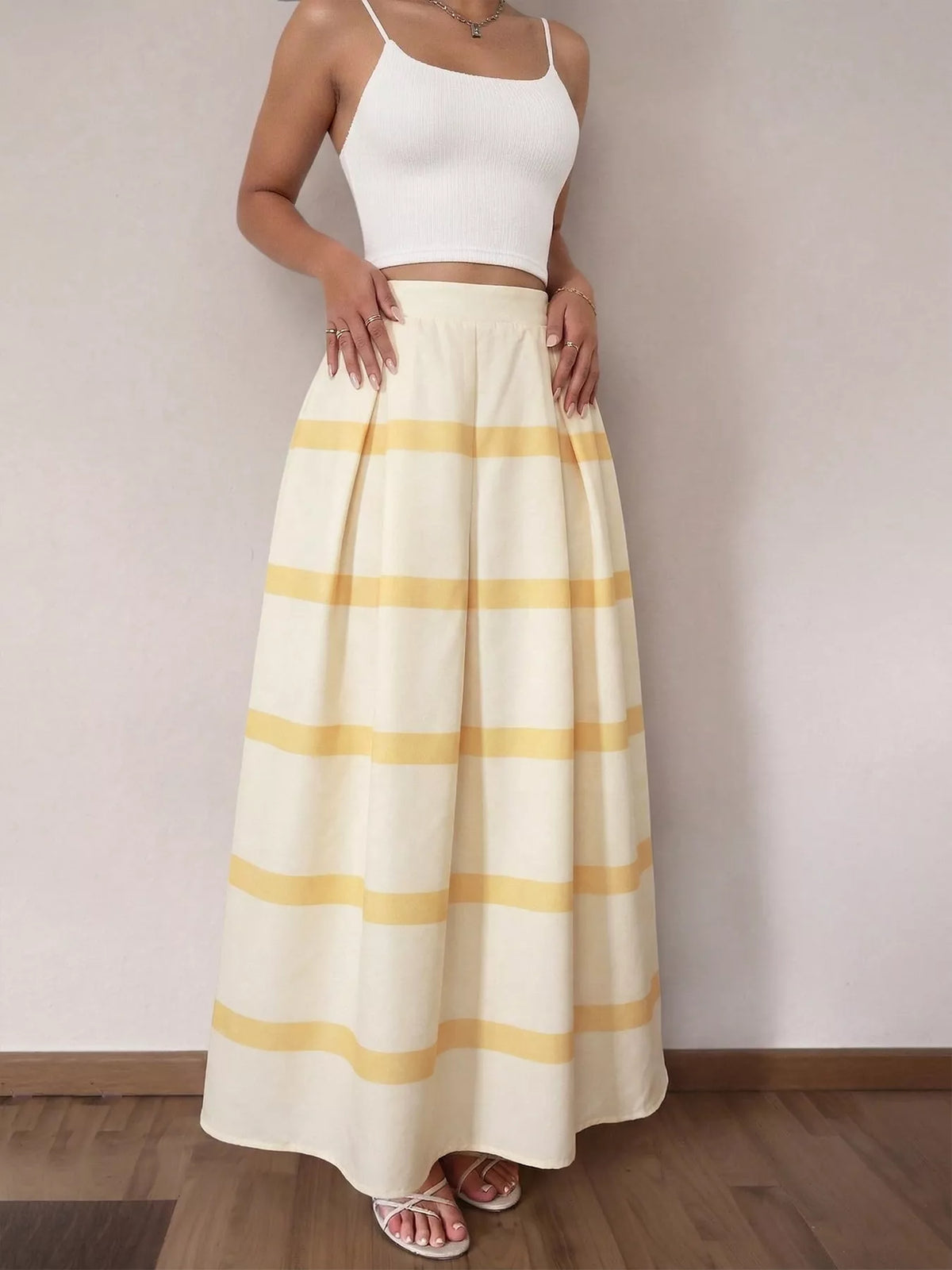 Yellow and white striped maxi skirt with elastic waist, ankle-length hem