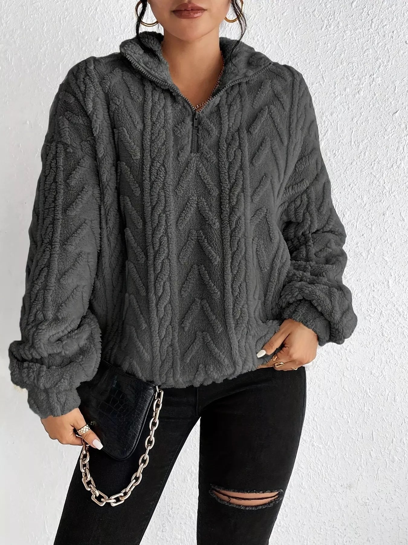 Dark gray sherpa quarter-zip sweatshirt with cable-knit texture and dropped shoulders