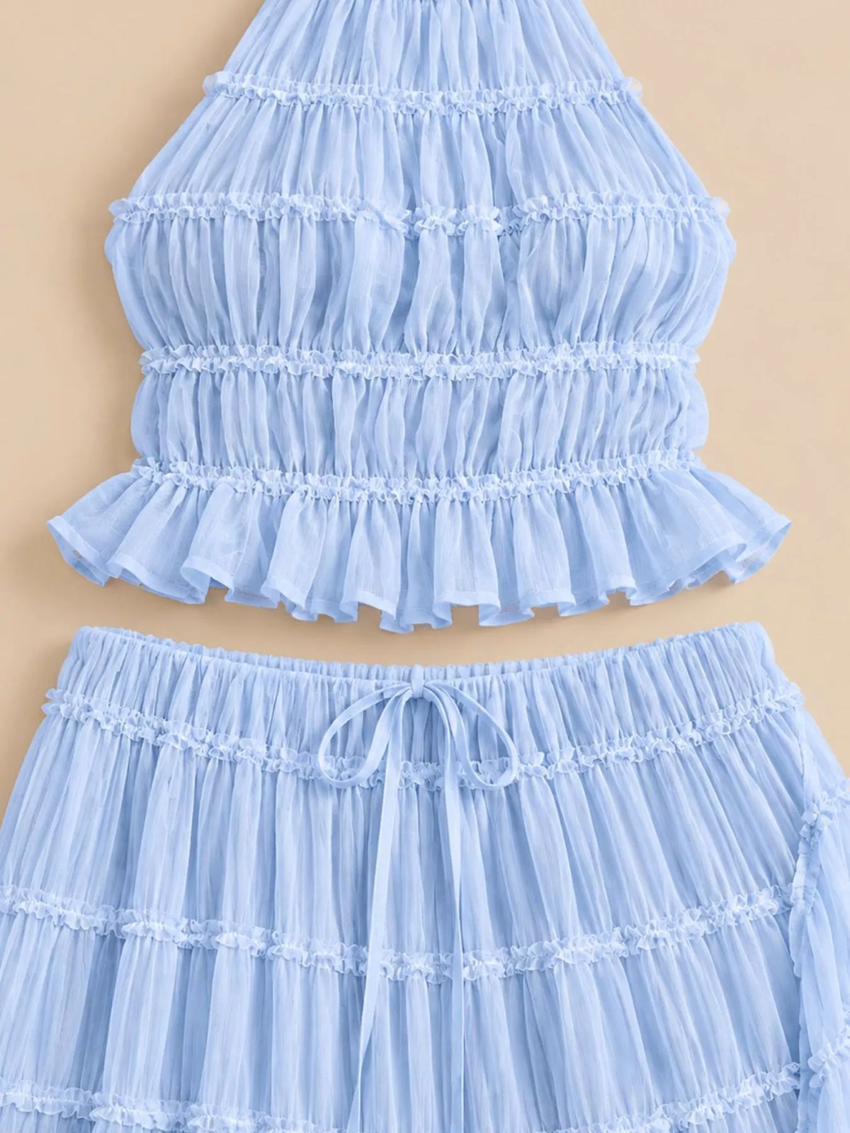 Sky blue halter ruffle crop top and tiered maxi skirt set, close-up tiers