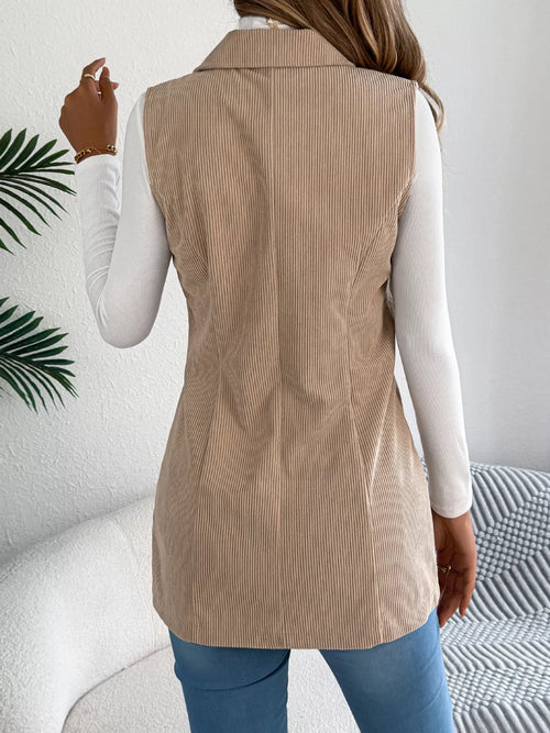 Back view of khaki longline button-front vest coat, vertical texture and shaped seams